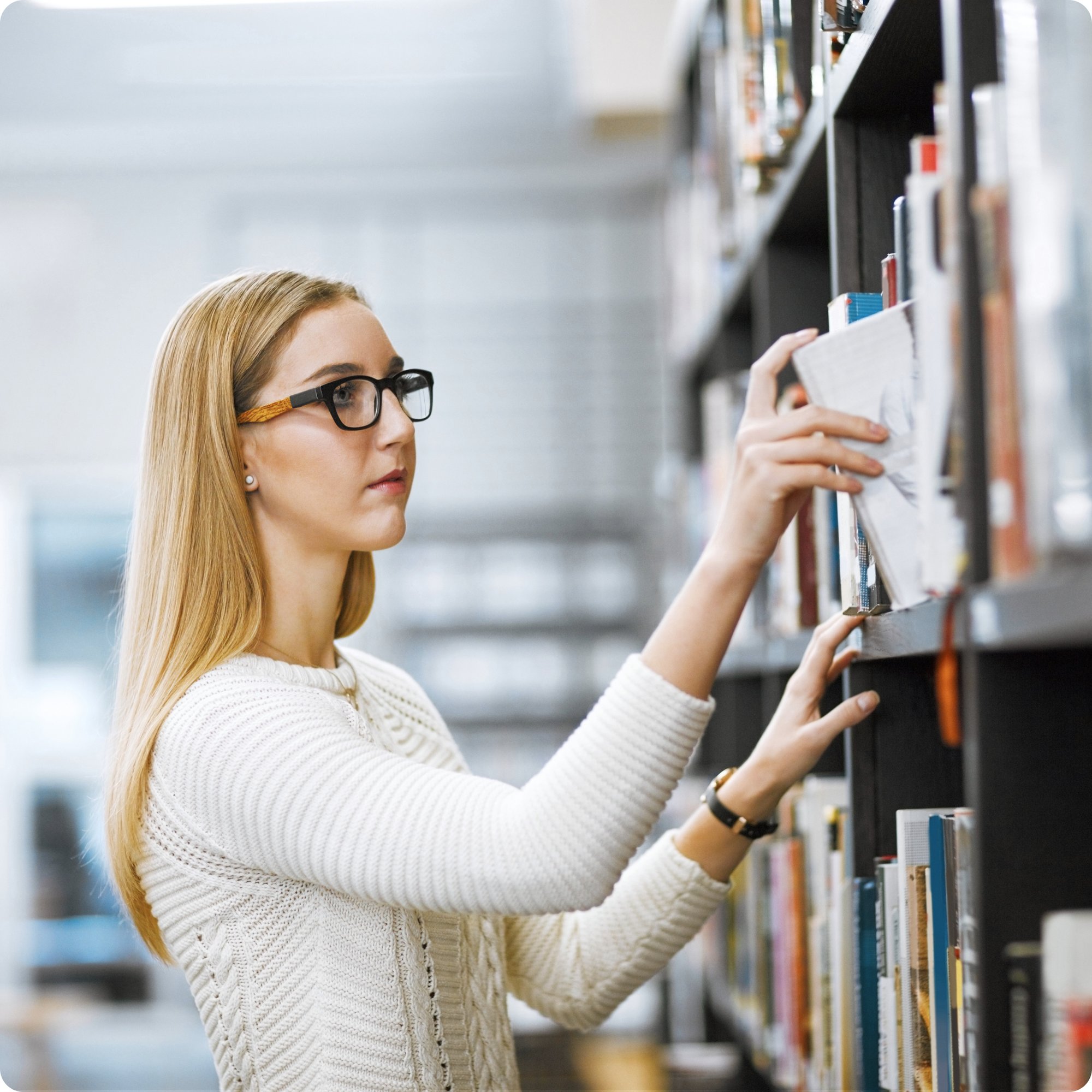 girl grabbing book